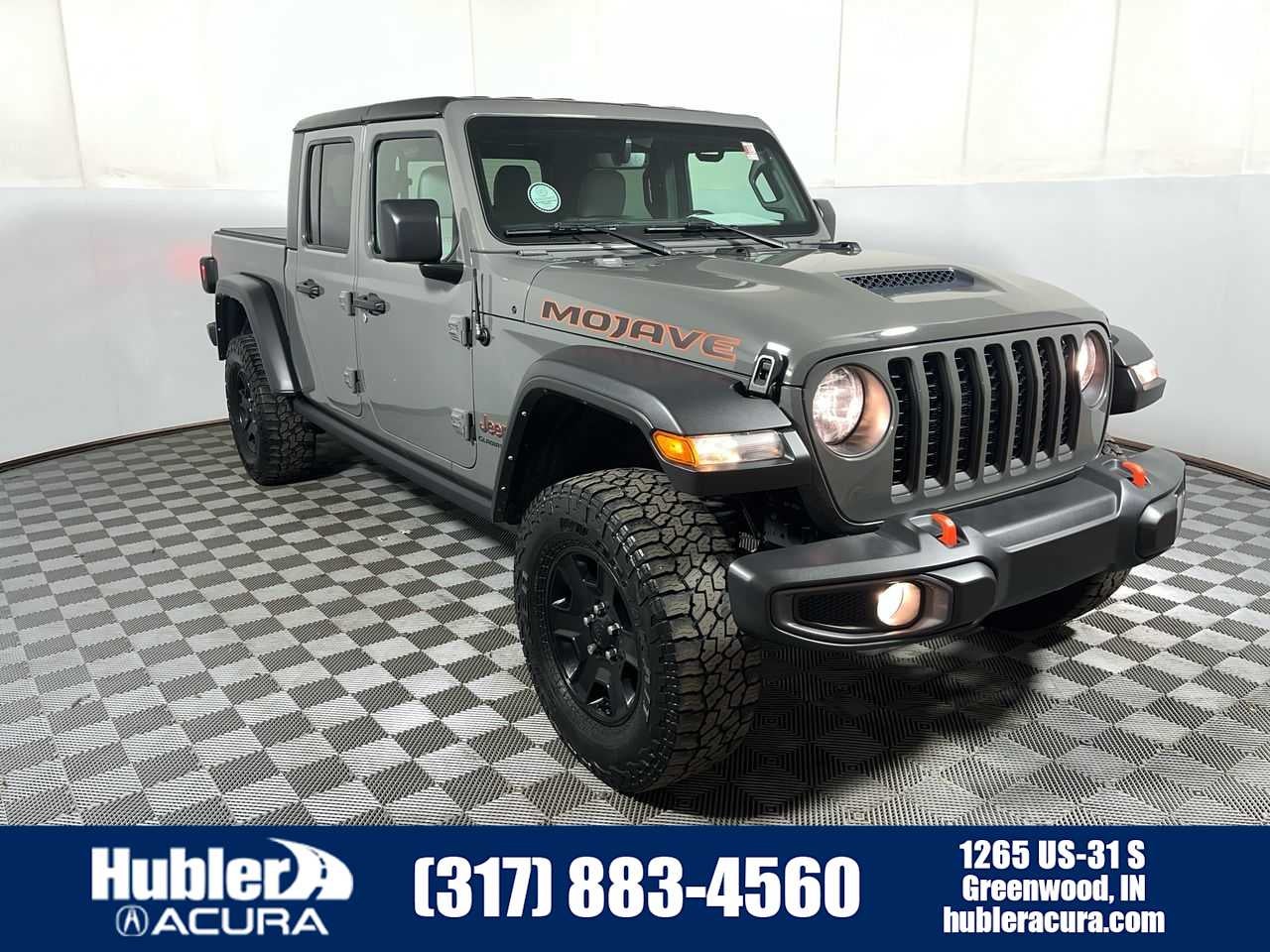 2022 Jeep Gladiator Mojave in Sting-Gray Clearcoat — front three-quarter view