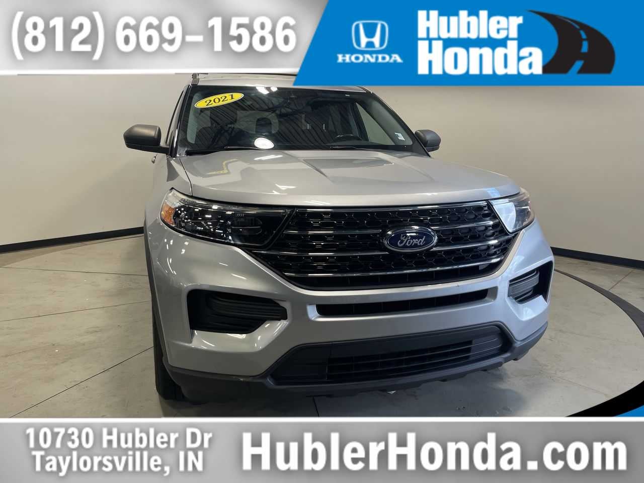 2021 Ford Explorer XLT in Iconic Silver — front three-quarter view