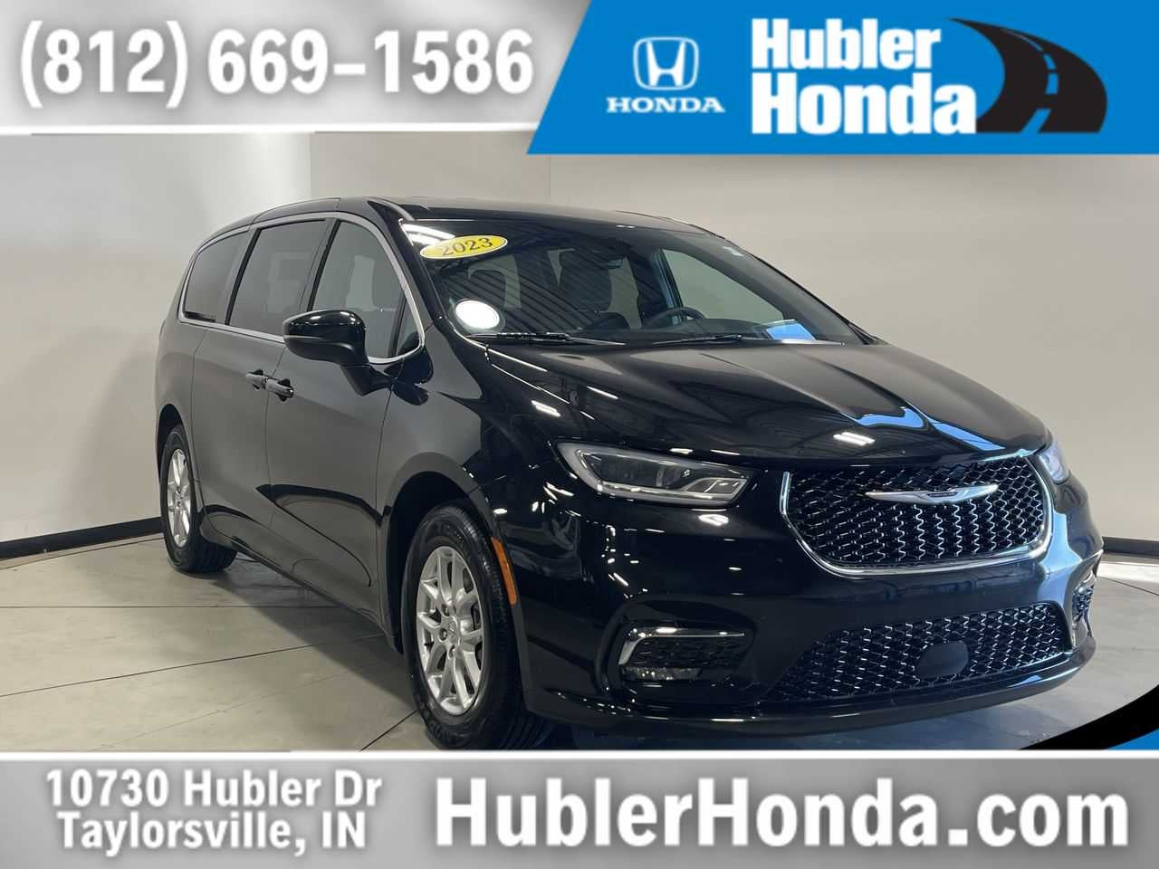 2023 Chrysler Pacifica Touring in Brilliant Black Crystal Pearlcoat — front three-quarter view