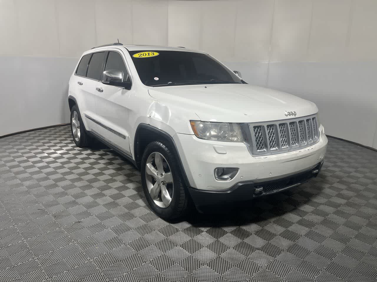 2013 Jeep Grand Cherokee — side profile view