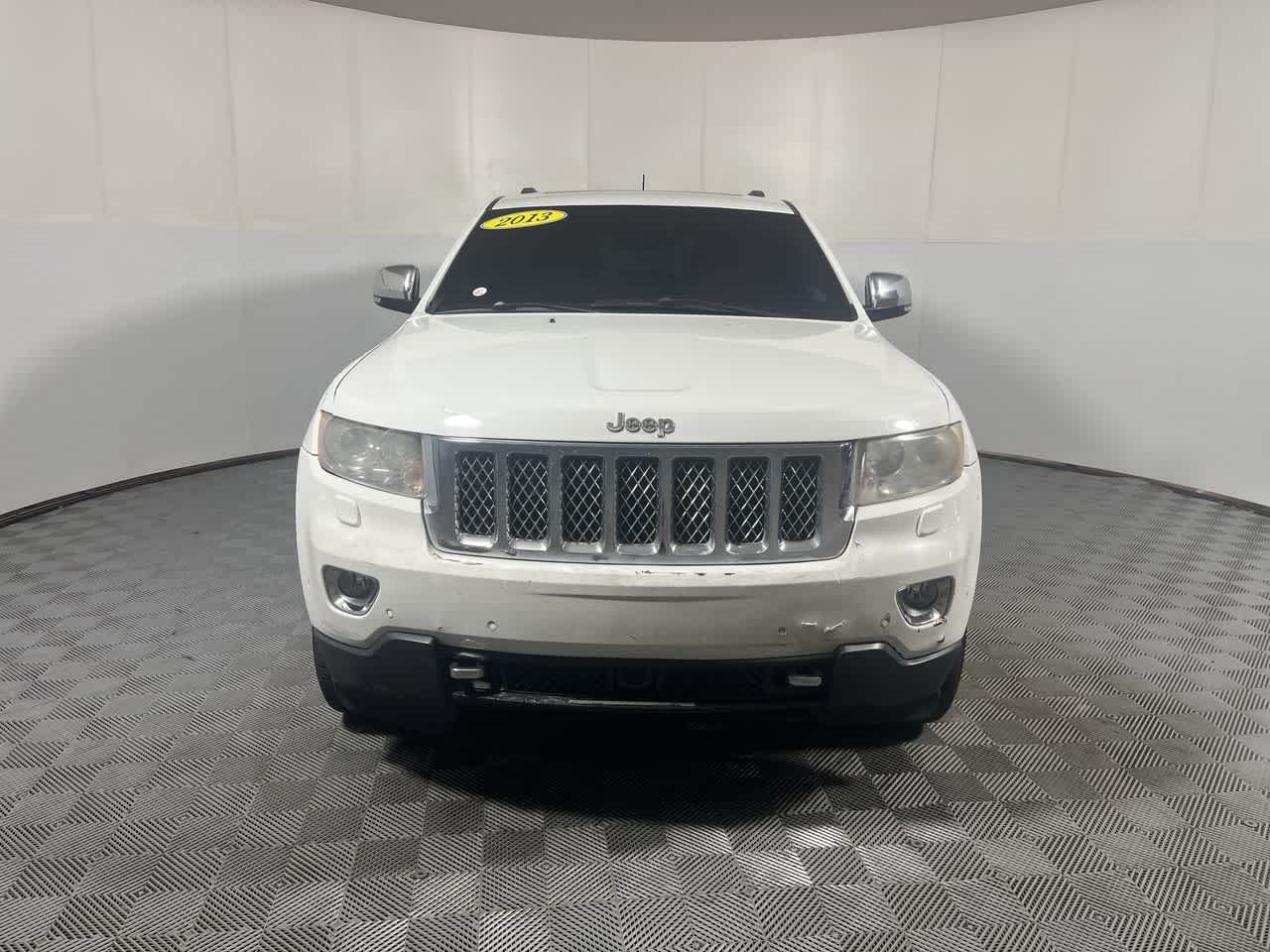 2013 Jeep Grand Cherokee — rear three-quarter view