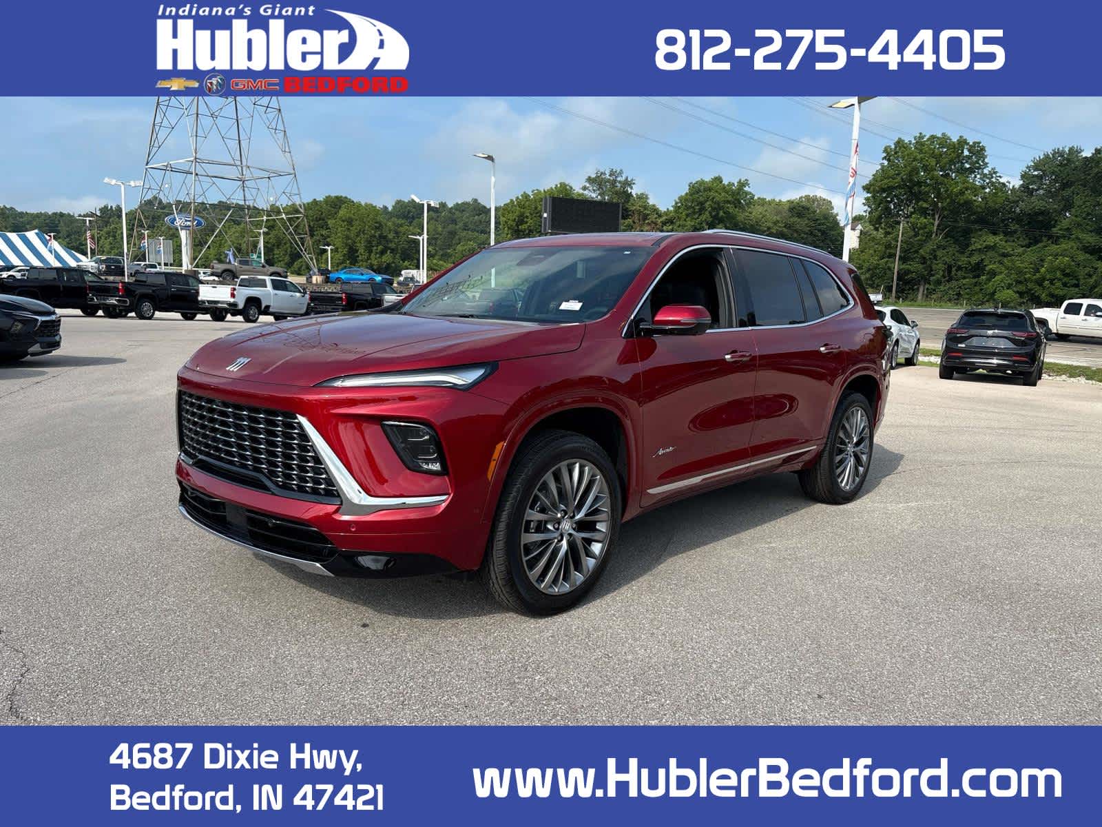 2026 Buick Enclave Avenir in Cherry Red Tintcoat — front three-quarter view