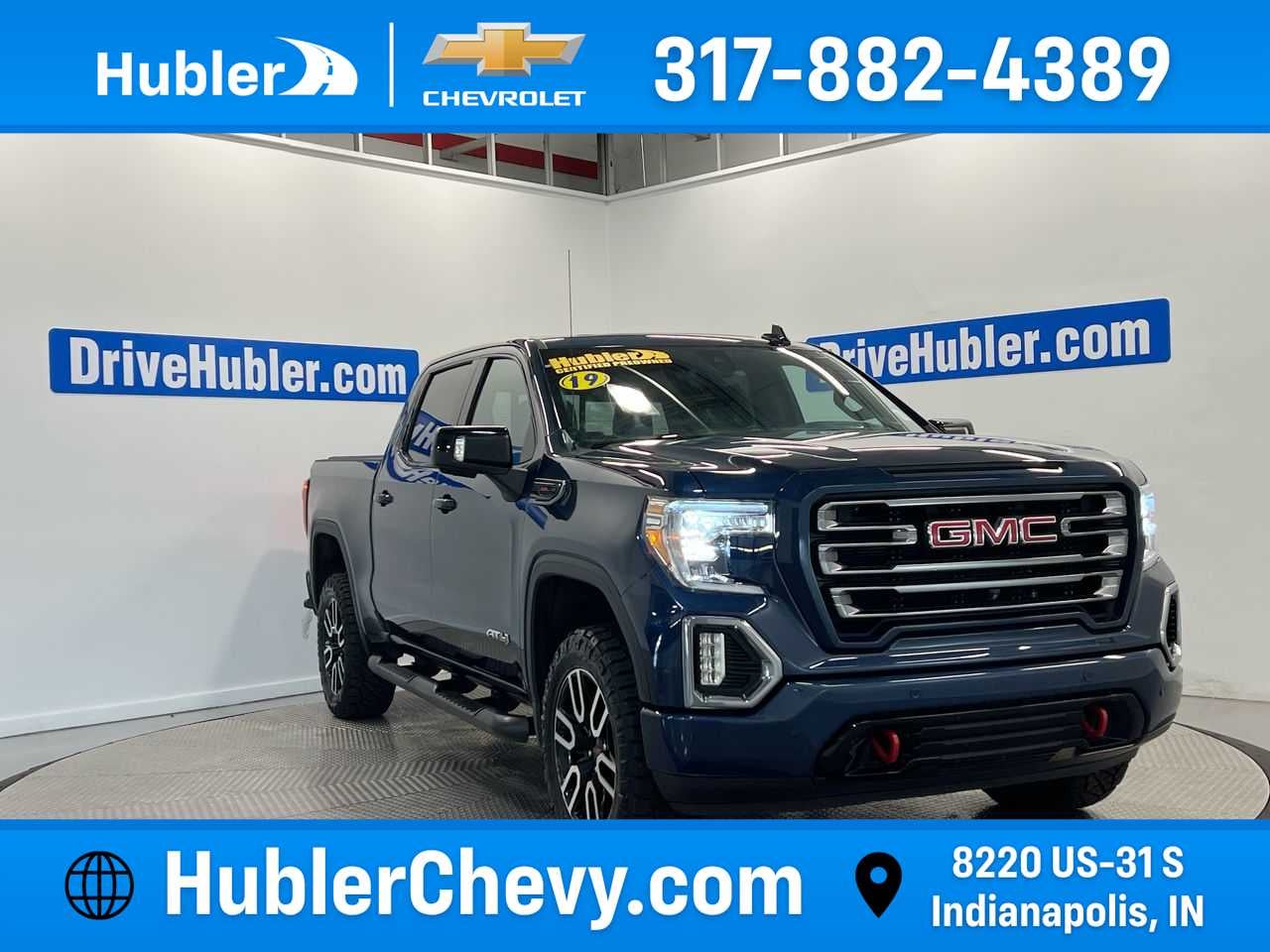 2019 GMC Sierra 1500 AT4 in Pacific Blue Metallic — front three-quarter view