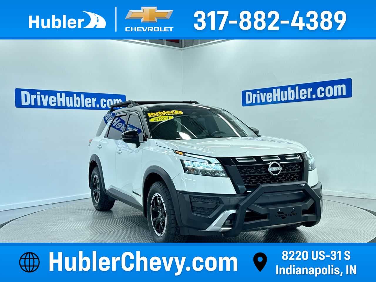 2024 Nissan Pathfinder Rock Creek in Ice Cap — front three-quarter view
