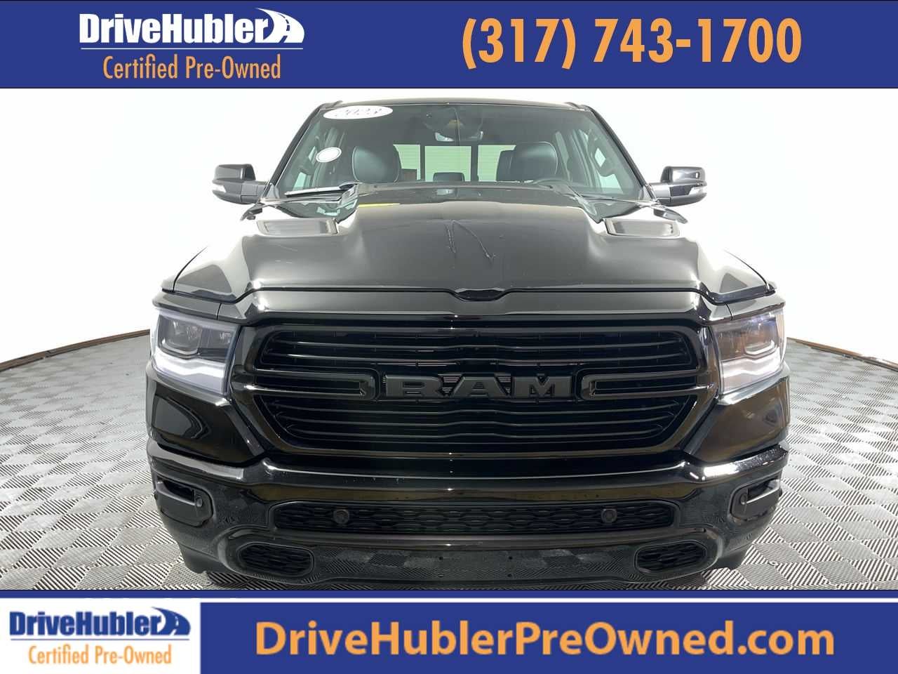 2023 RAM 1500 Laramie in Diamond Black Crystal Pearlcoat — front three-quarter view
