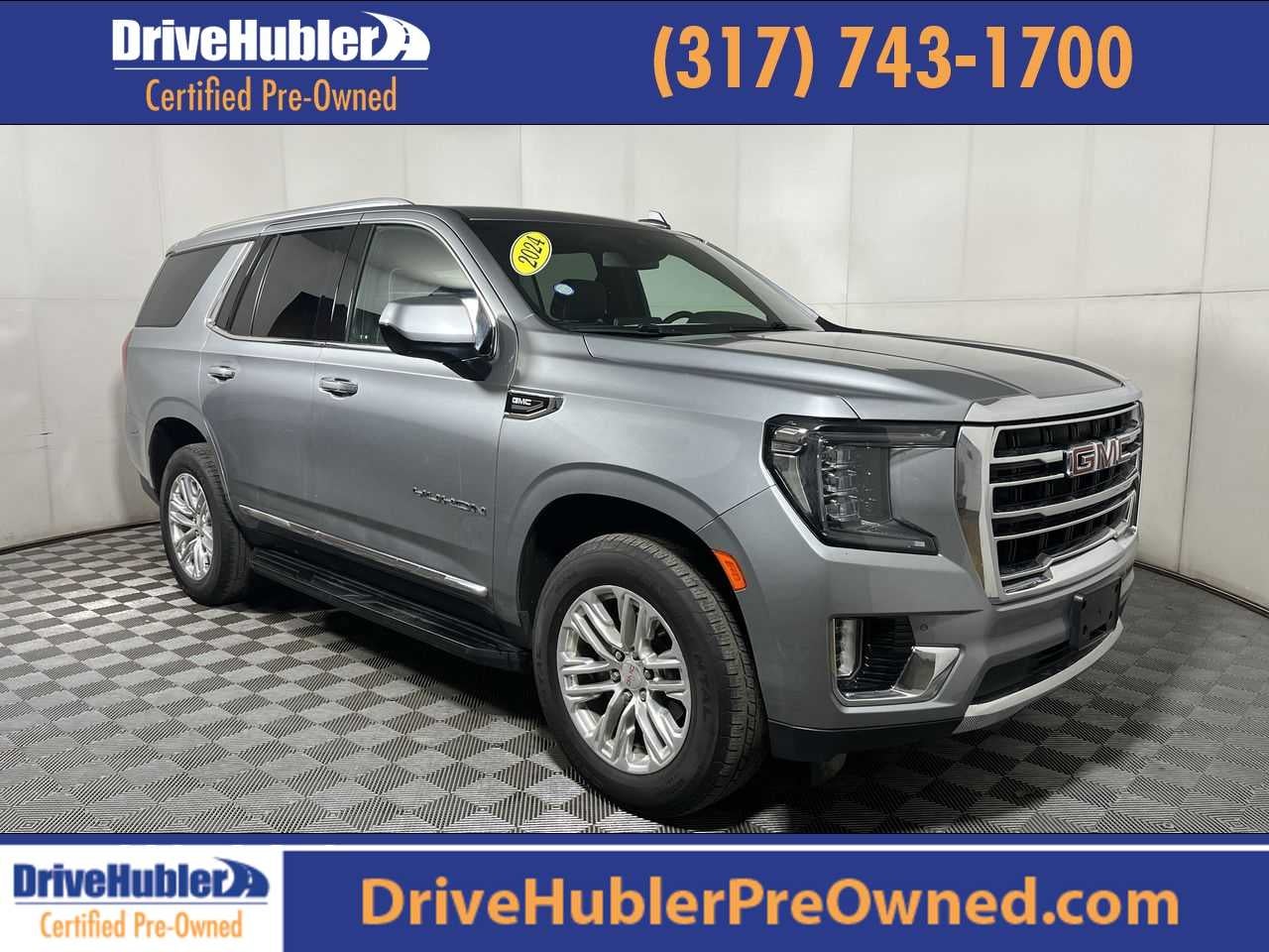 2024 GMC Yukon SLT in Sterling Metallic — front three-quarter view