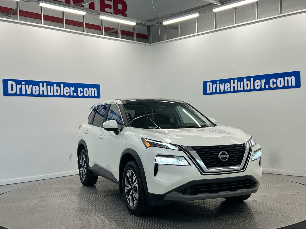 2023 Nissan Rogue SV in Pearl White Tricoat — front three-quarter view
