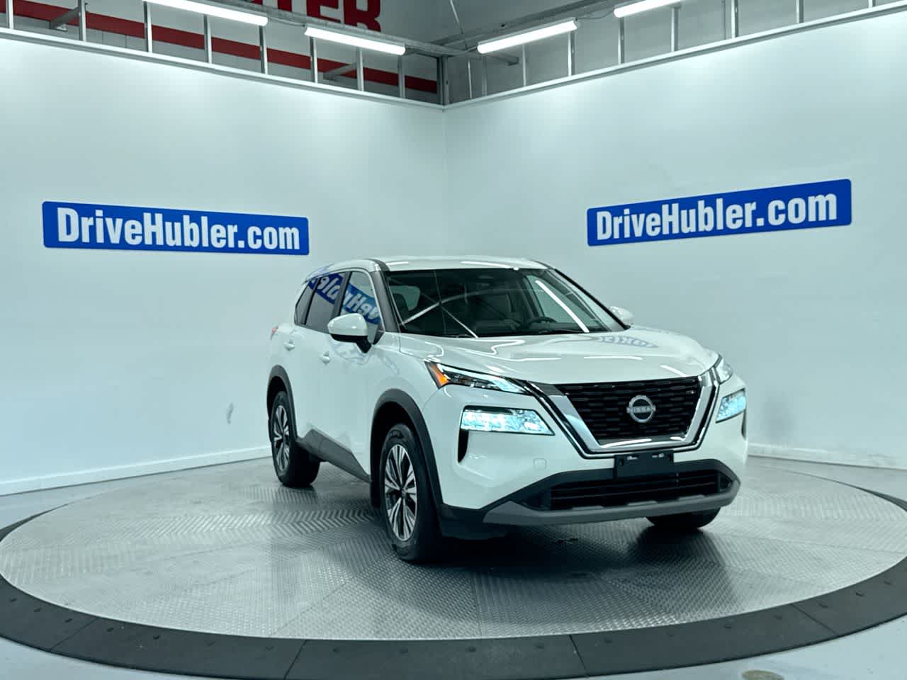 2023 Nissan Rogue SV in Pearl White Tricoat — front three-quarter view